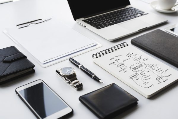 Closeup of black and white stationery on white table