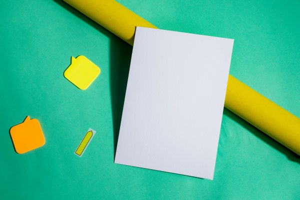 Mock-up brochure and roll of yellow paper