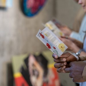 People reading brochures at exhibition