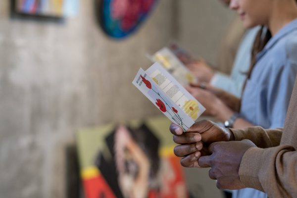 People reading brochures at exhibition