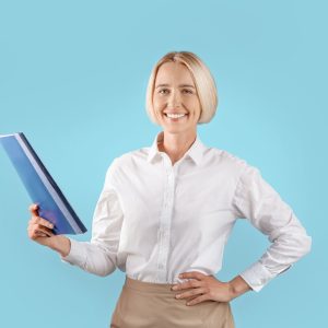 Portrait of positive female entrepreneur in office wear holding folder with documents over blue