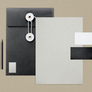 Stationery set with string envelope folders, business cards, and pencils